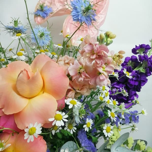 Copenhagen bouquet. It feels like you picked the flower in a lovely meadow. Exquisite bright flower arrangement featuring Lovely roses, elegant Clematis, perfume plant night-scented delphinium, campanula, pink Anthurium, aromatic Matricaria (that makes me think in lots of happy faces!) & Australian sweet scented eucalyptus.