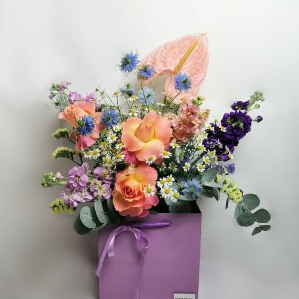 Copenhagen bouquet. It feels like you picked the flower in a lovely meadow. Exquisite bright flower arrangement featuring Lovely roses, elegant Clematis, perfume plant night-scented delphinium, campanula, pink Anthurium, aromatic Matricaria (that makes me think in lots of happy faces!) & Australian sweet scented eucalyptus.