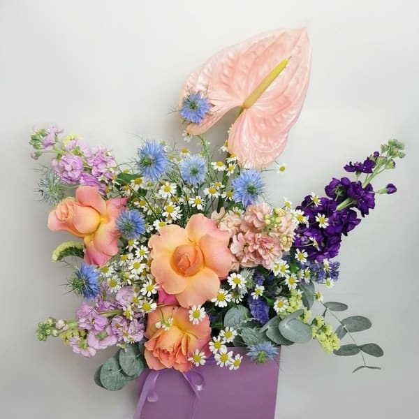 Copenhagen bouquet. It feels like you picked the flower in a lovely meadow.  Exquisite bright flower arrangement featuring Lovely roses, elegant Clematis, perfume plant night-scented delphinium, campanula, pink  Anthurium, aromatic Matricaria (that makes me think in lots of happy faces!) & Australian sweet scented eucalyptus.